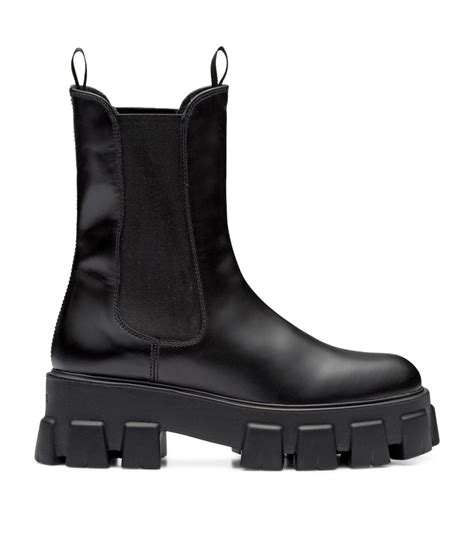 Monolith leather ankle boots in black .